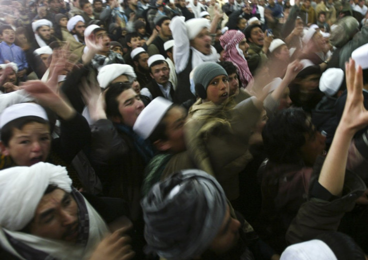 Afghan protesters shout anti-U.S. slogans during a protest against the burning of Korans by US troops