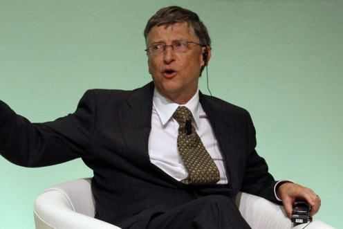 Bill Gates gestures as he speaks during an IFAD Annual Governing Council in Rome