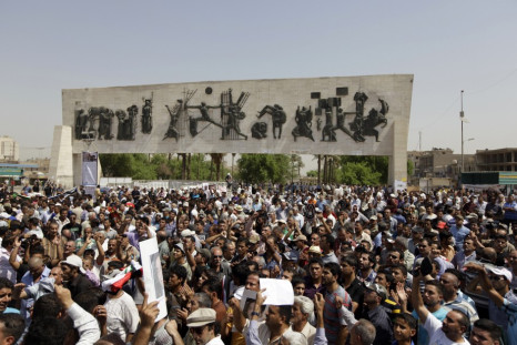 Residents gather at Tahrir Square during a demonstration in central Baghdad