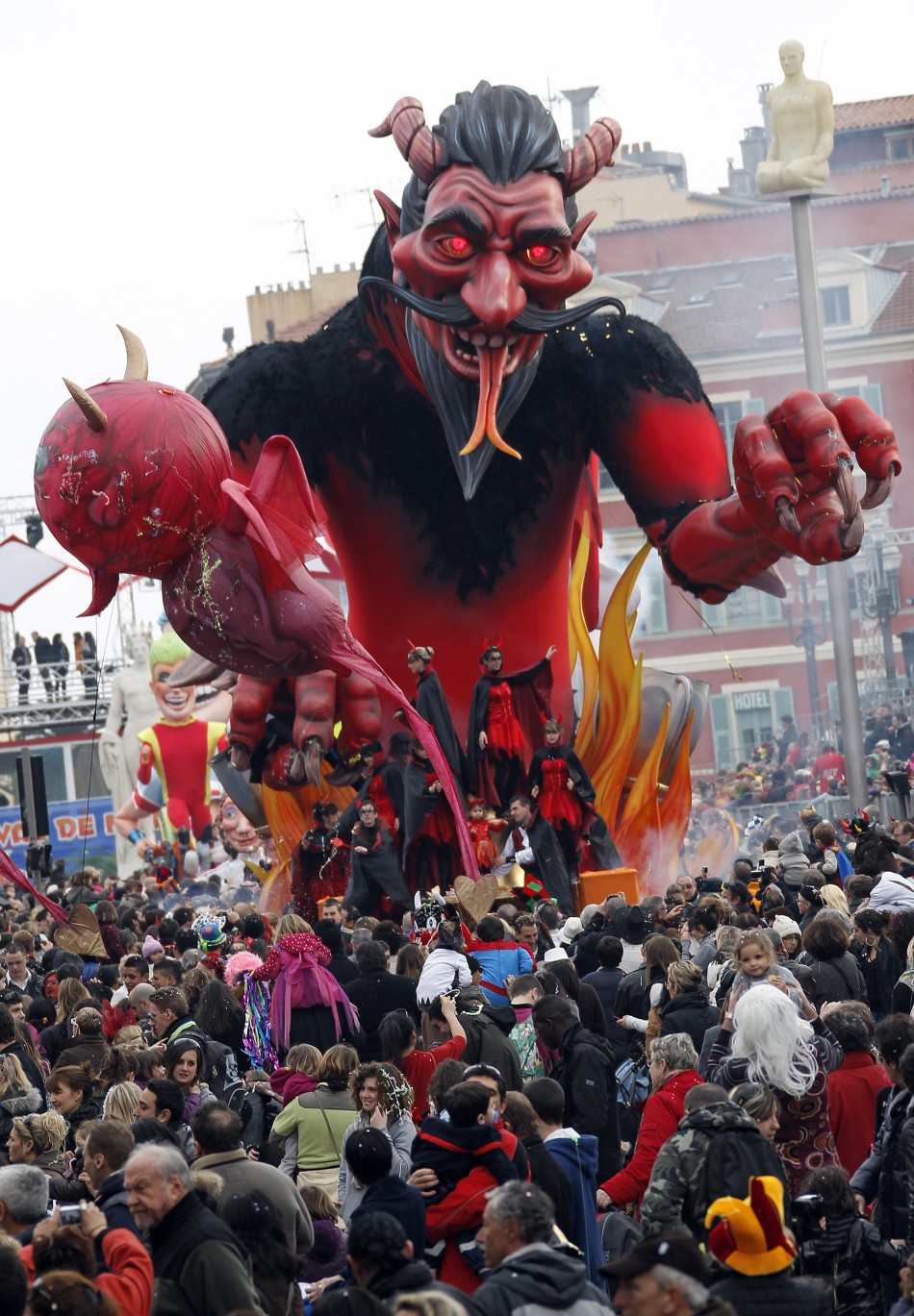 A float with a giant figure representing a devil is paraded during the Nice Carnival