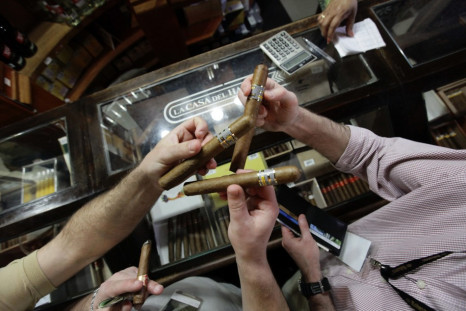 People buy cigars at a store