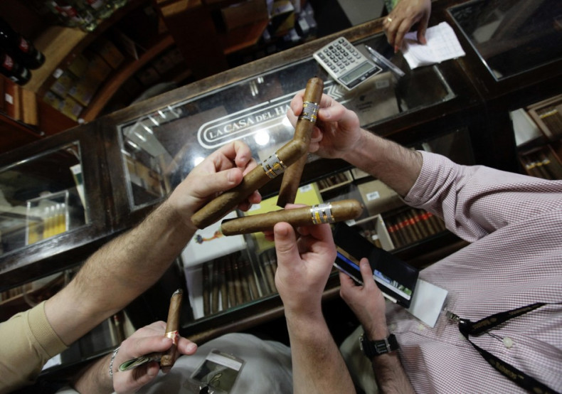 People buy cigars at a store