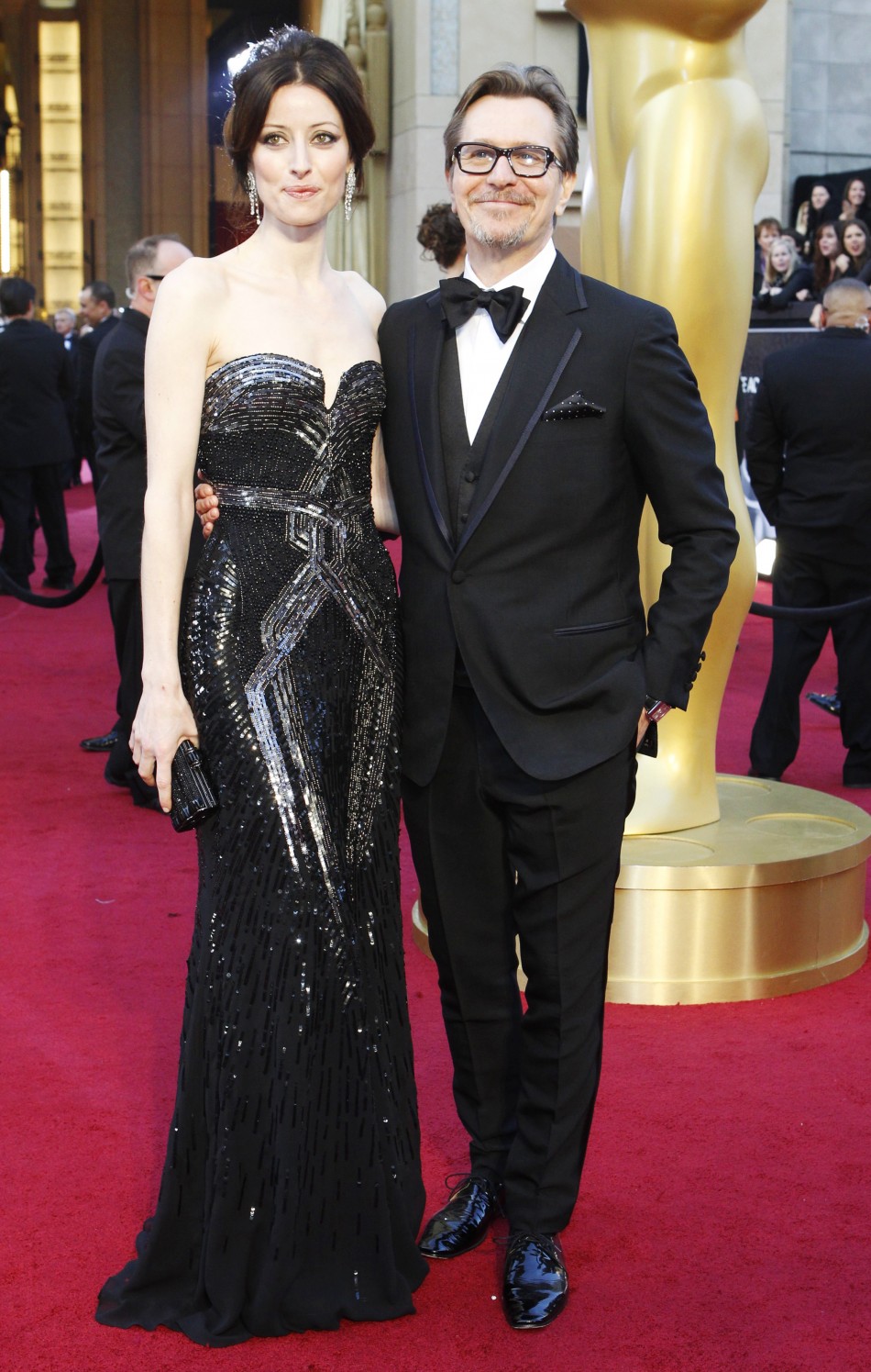 Gary Oldman, best actor nominee for his role in quotTinker Tailor Soldier Spyquot, and his wife Alexandra Edenborough arrive at the 84th Academy Awards in Hollywood