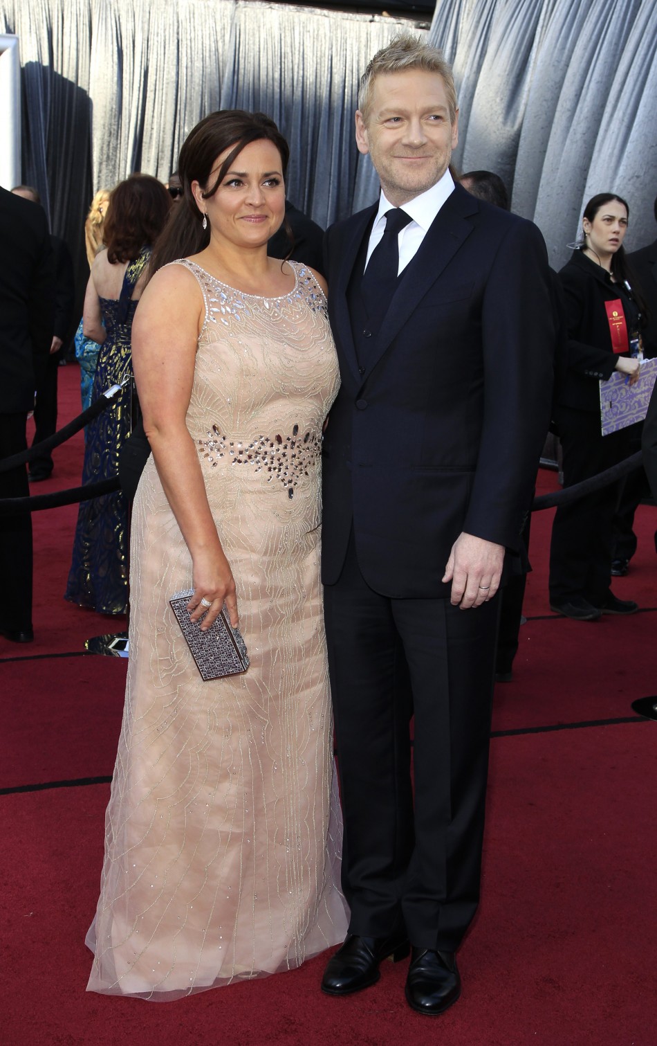 Actor Kenneth Branagh and his wife Lindsay Brunnock pose as they arrive at the 84th Academy Awards in Hollywood