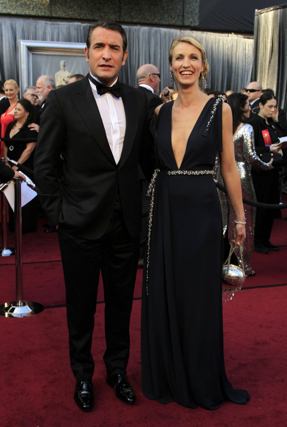French actor Dujardin and his wife Alexandra Lamy arrive at the 84th Academy Awards in Hollywood