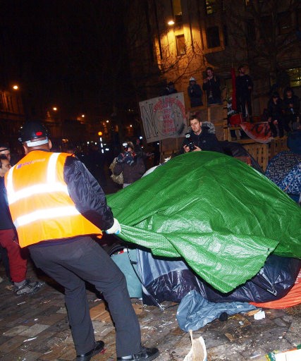 Corporation of London workers remove tents and other structures from the square in front of St Paul039s Cathedral, where anti-capitalist protesters have been camped since November.