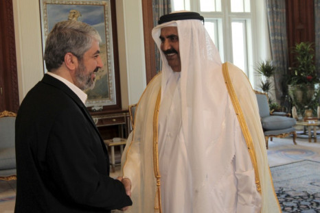 Qatar's Emir Sheikh Hamad bin Khalifa al Thani and  Hamas leader Khaled Meshaal before a meeting in Doha