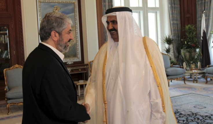 Qatar's Emir Sheikh Hamad bin Khalifa al Thani and  Hamas leader Khaled Meshaal before a meeting in Doha