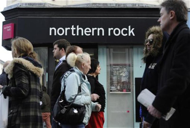 People pass a branch of Northern Rock bank in Newcastle