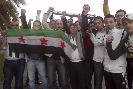 Syrians living in UAE shout slogans against Syrian President Bashar Al-Assad