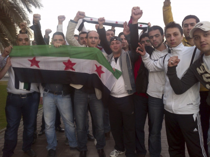 Syrians living in UAE shout slogans against Syrian President Bashar Al-Assad