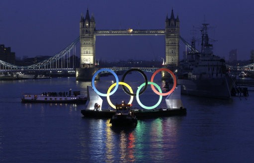 Backdropped by Canary Wharf in the distance, a giant Olympic Rings floats on the River Thames in London in the run-up for the Olympic games, during its launch to mark 150-days until the start of the London 2012 Olympic games, Tuesday