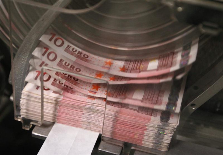 A machine counts and sorts out euro notes at the Belgian Central Bank in Brussels