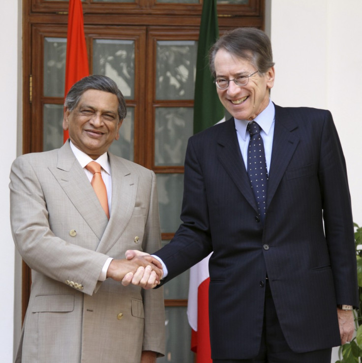 Italian Foreign Minister Terzi shakes hands with his Indian counterpart Krishna