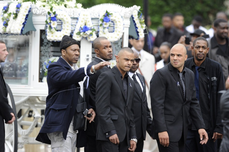 Relatives and friends of Mark Duggan arrive at New Testament Church of God in north London for his funeral