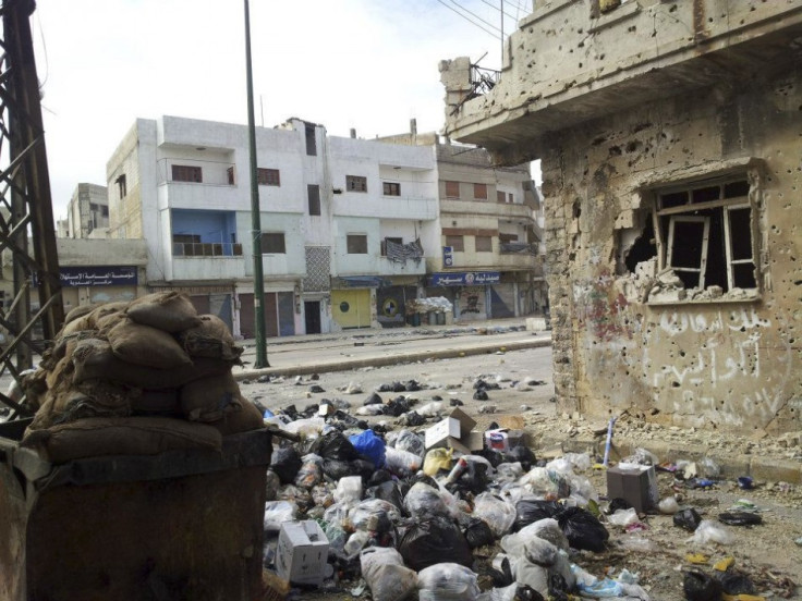 Damaged houses are seen in Homs