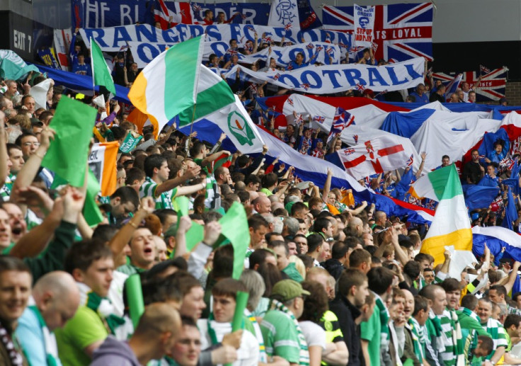 Celtic fans cheer in stands during Old Firm derby