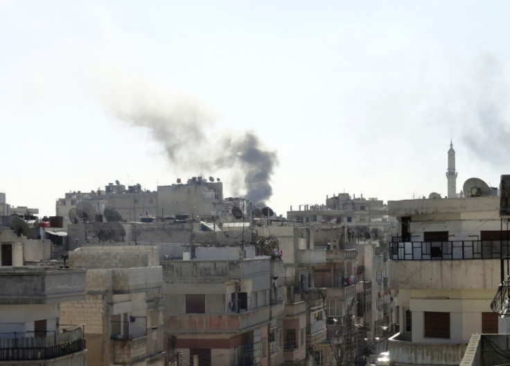 Smoke from shelling rises over the Khaldiyeh area in Homs city