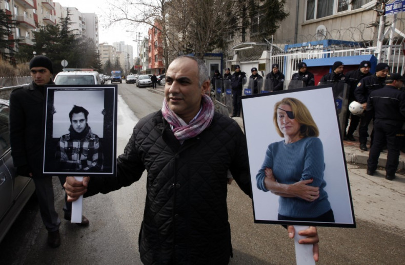 A Turkish journalist attend a demonstration against the killings of journalists in Syria, in front of the Syrian Embassy in Ankara