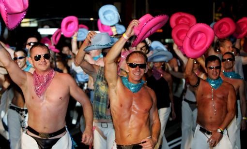Gay cowboy performers dance during the annual Gay and Lesbian Mardi Gras Parade in Sydney, Australia, Saturday, March 4, 2006
