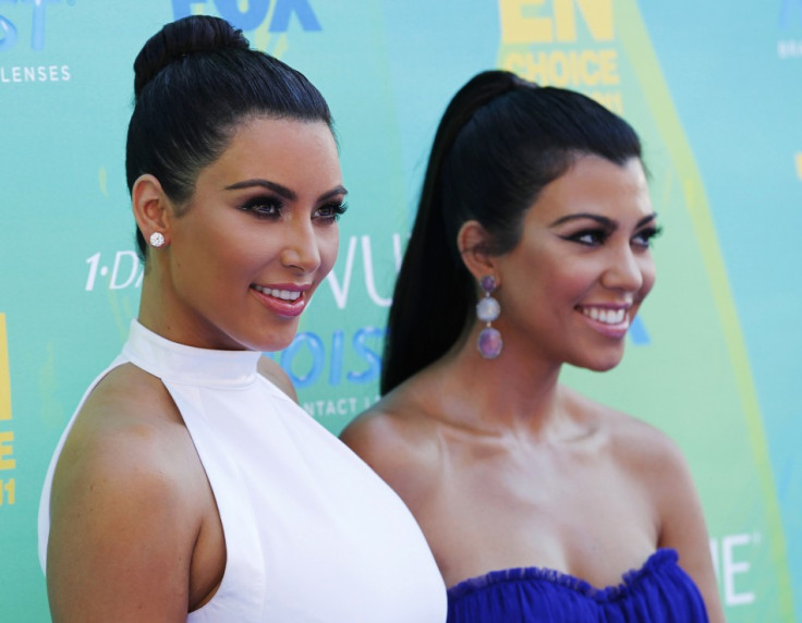 Kim Kardashian (L) and Kourtney Kardashian