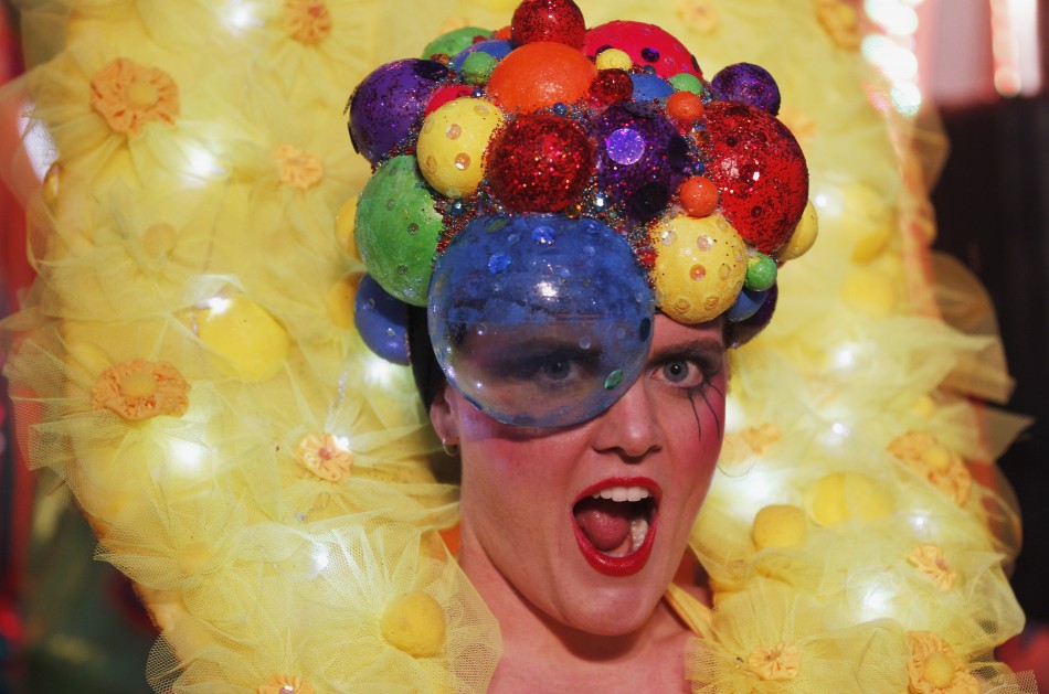 A reveller poses for pictures during the 34th annual gay and lesbian Mardi Gras parade in central Sydney