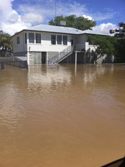 A house is surrounded by floodwaters on a street of the town of Moreeabout 610 km 379 miles north of Sydney