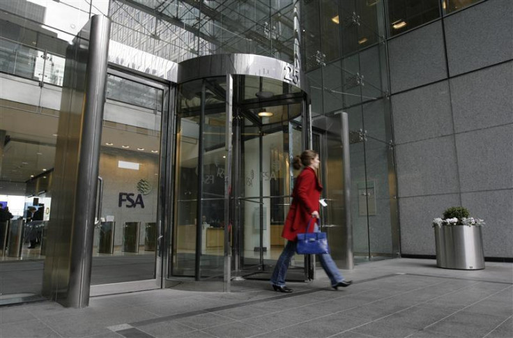 A woman leaves the office in Canary Wharf, London