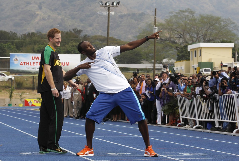 Britain039s Prince Harry L looks on as Olympic gold medallist Usain Bolt poses
