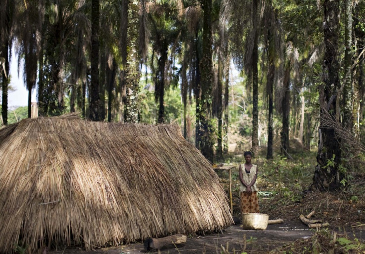 A woman who fled attacks by Ugandan LRA rebels stands outside a makeshift shelter at Ngalima in northeastern Congo