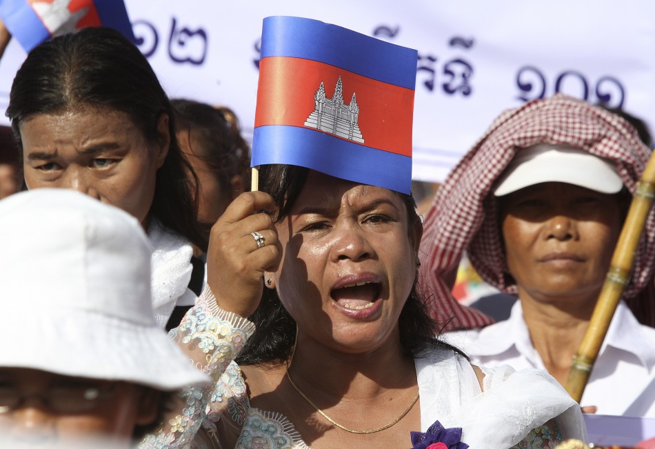 A Cambodian woman shouts as she marches on a street to celebrate International Womens Day in central Phnom Penh