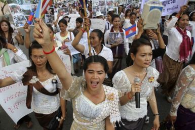Cambodian woman shouts slogans while marching to mark International Women's Day in central Phnom Penh