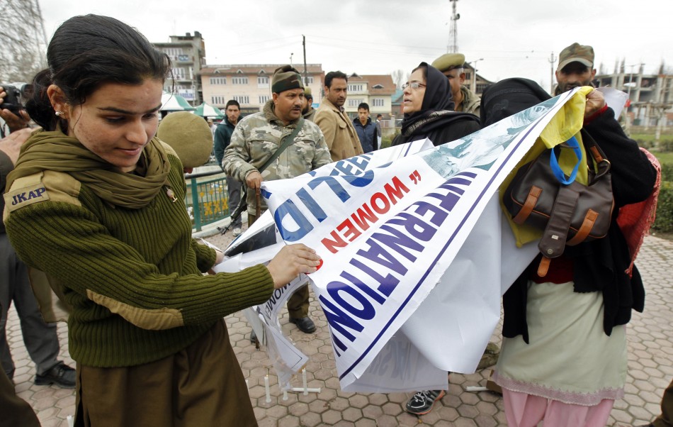 Policewoman snatches banner from members of Kashmiri womens separatist group in Srinagar