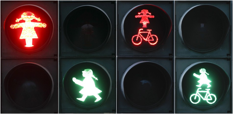 A combination of four pictures show red and green crossing signals for pedestrian and cyclists featuring a woman in the east German town of Fuerstenwalde