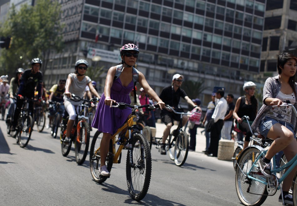 Women ride bicycles during an event to celebrate International Womens Day in downtown Mexico City