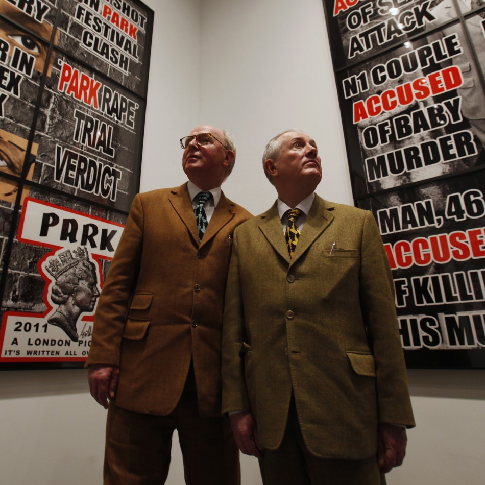 Artists Gilbert  George pose in front of their new exhibition quotLondon Picturesquot at a White Cube gallery in London