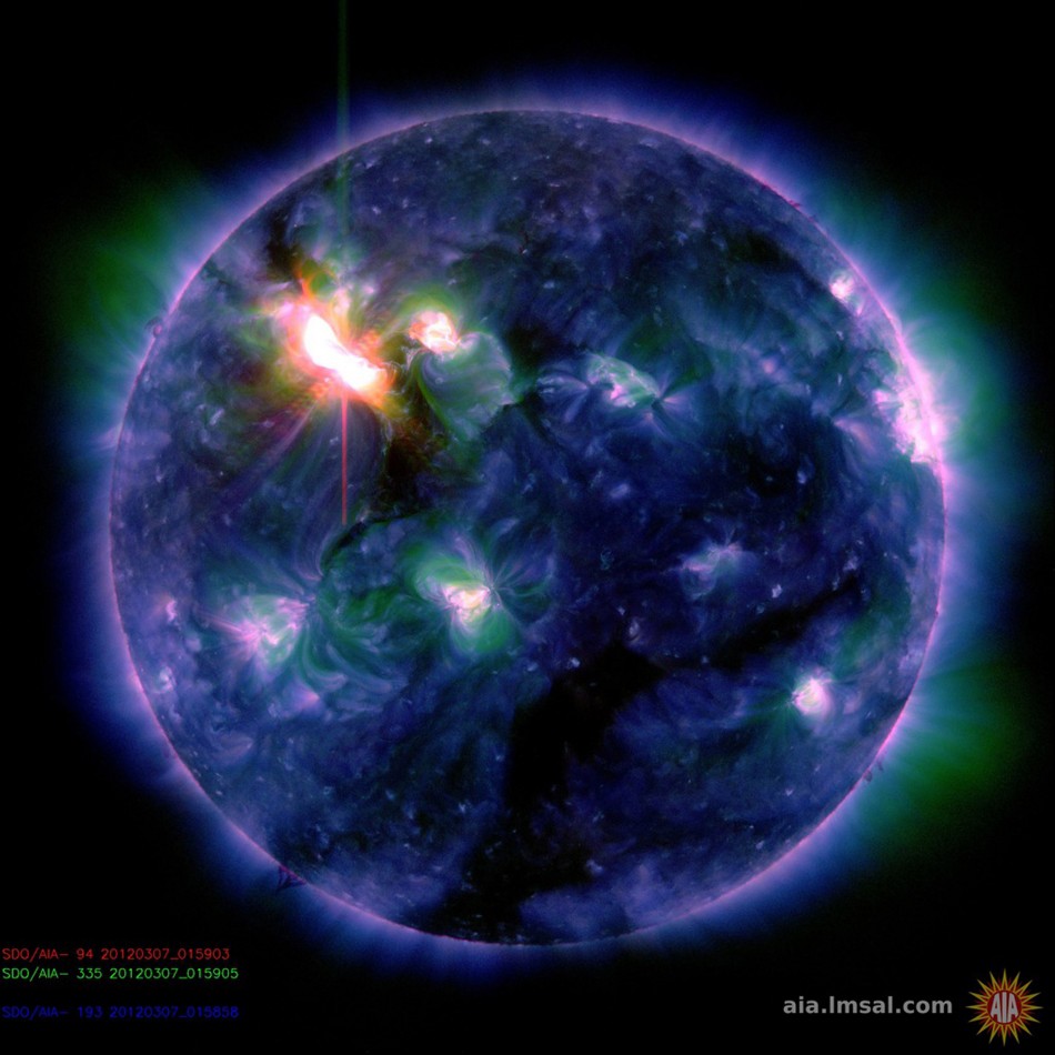 A multi-colored NASA handout photo of the Sun