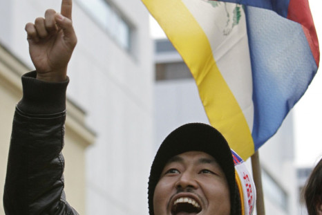 A Tibetan demonstrator shouts slogans during a protest rally in front of the Chinese embassy