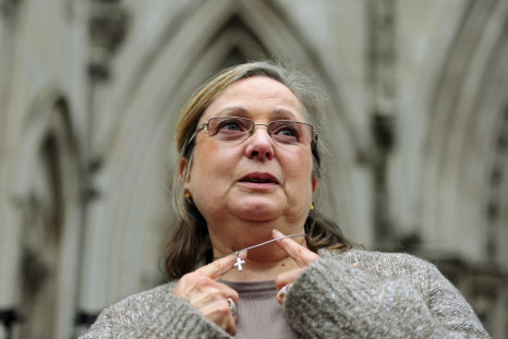 Britain's Eweida shows off her cross on a chain as she arrives at the High Court in London in 2010
