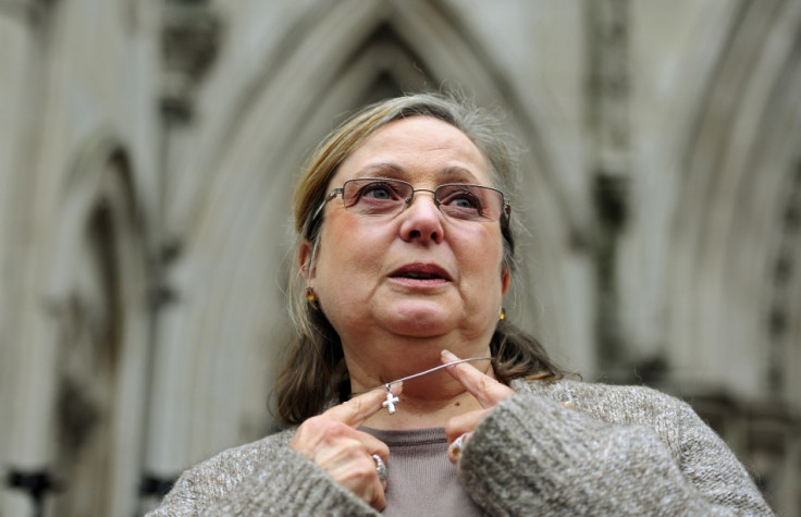 Britain's Eweida shows off her cross on a chain as she arrives at the High Court in London in 2010