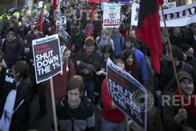 Students protesting against tuition fee increases march towards the business district in the City of London last year