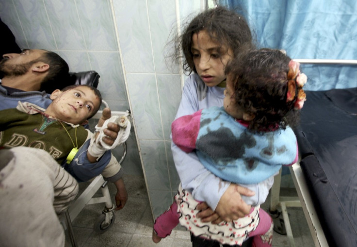 Wounded Palestinian children are seen in a hospital in the northern Gaza Strip, after an Israeli air strike