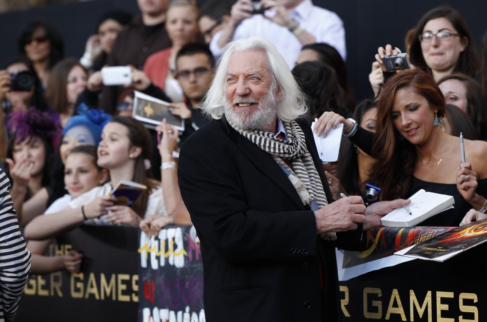 Cast member Donald Sutherland signs autographs at the premiere of quotThe Hunger Gamesquot at Nokia theatre in Los Angeles