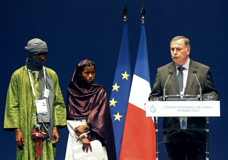 World Water Council president Fauchon delivers a speech next to Malian students at the 6th World Water Forum in Marseille