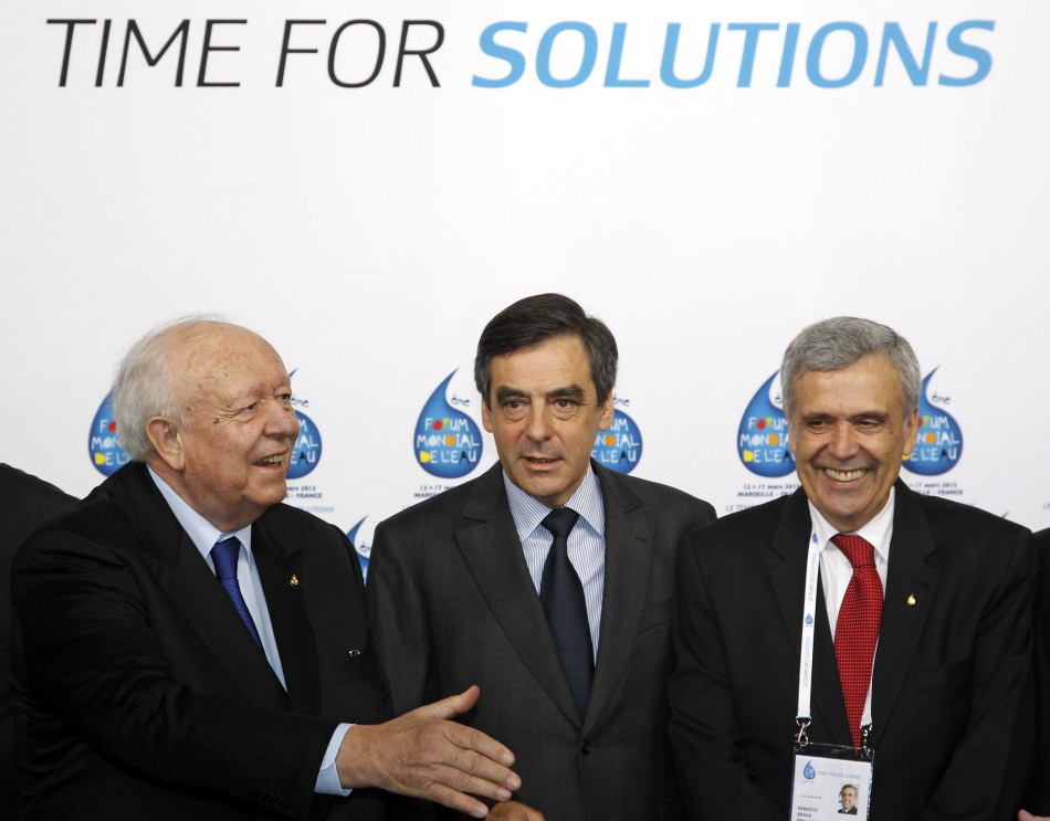 Frances Prime Minister Fillon surrounded by Marseilles mayor Gaudin and President of the International Forum Committee Benedito Braga arrive at the 6th World Water Forum in Marseille