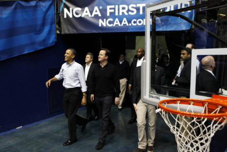 U.S. President Obama and British Prime Minister Cameron arrive at NCAA basketball tournamnet game in Ohio