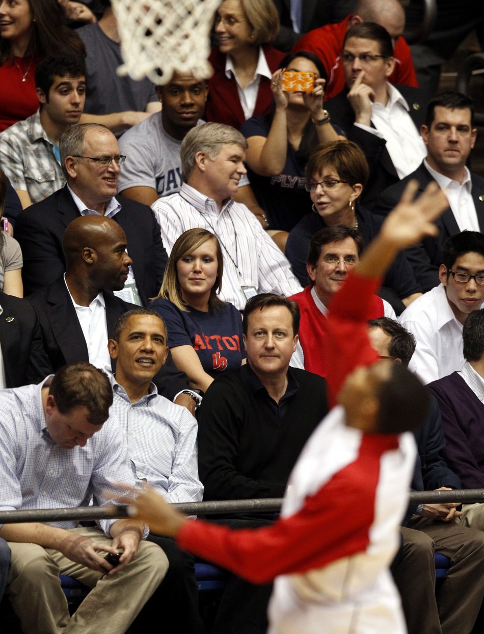 U.S. President Barack Obama sits next to British Prime Minister David Cameron