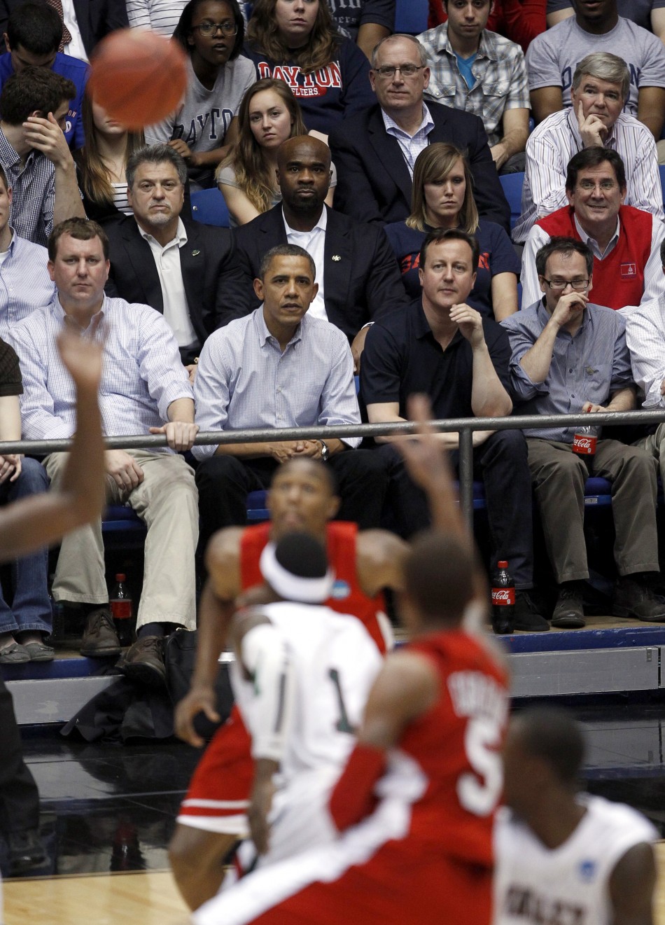 U.S. President Barack Obama and British Prime Minister David Cameron attend a NCAA tournament