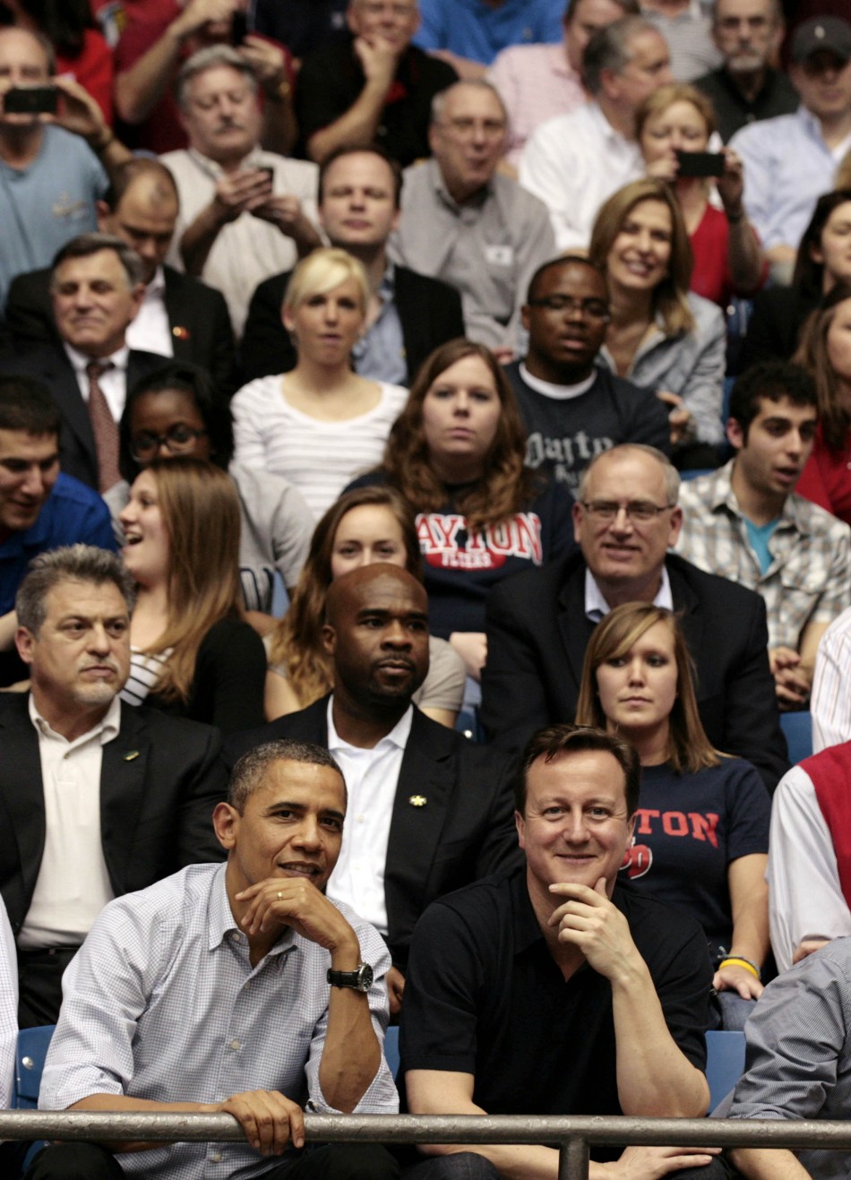 U.S. President Obama and British Prime Minister Cameron in crowd during NCAA basketball tournamnet