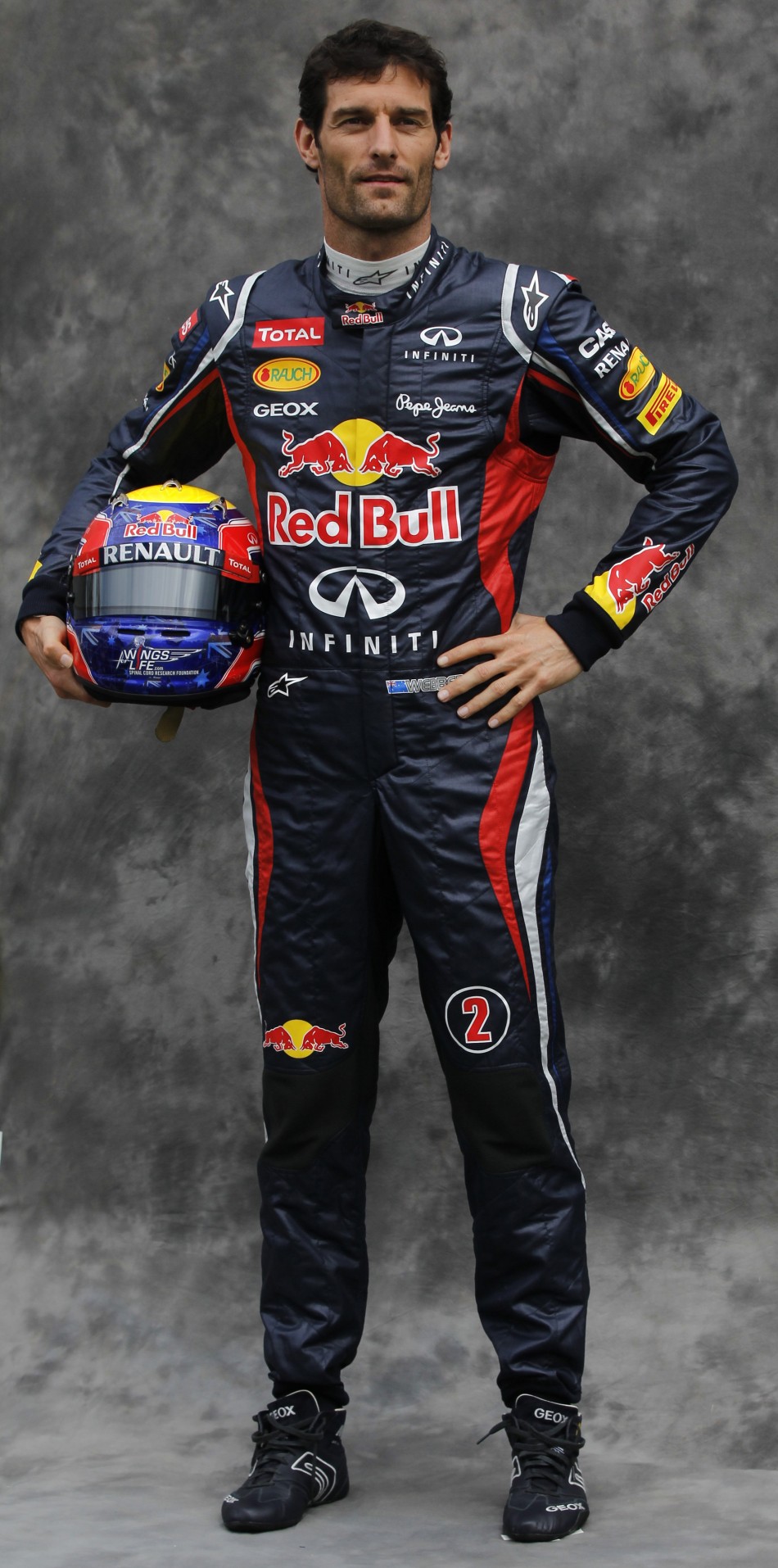Red Bull Formula One driver Webber poses prior to the Australian F1 Grand Prix at the Albert Park circuit in Melbourne